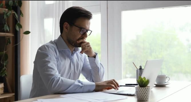 Man Free will writing on his computer