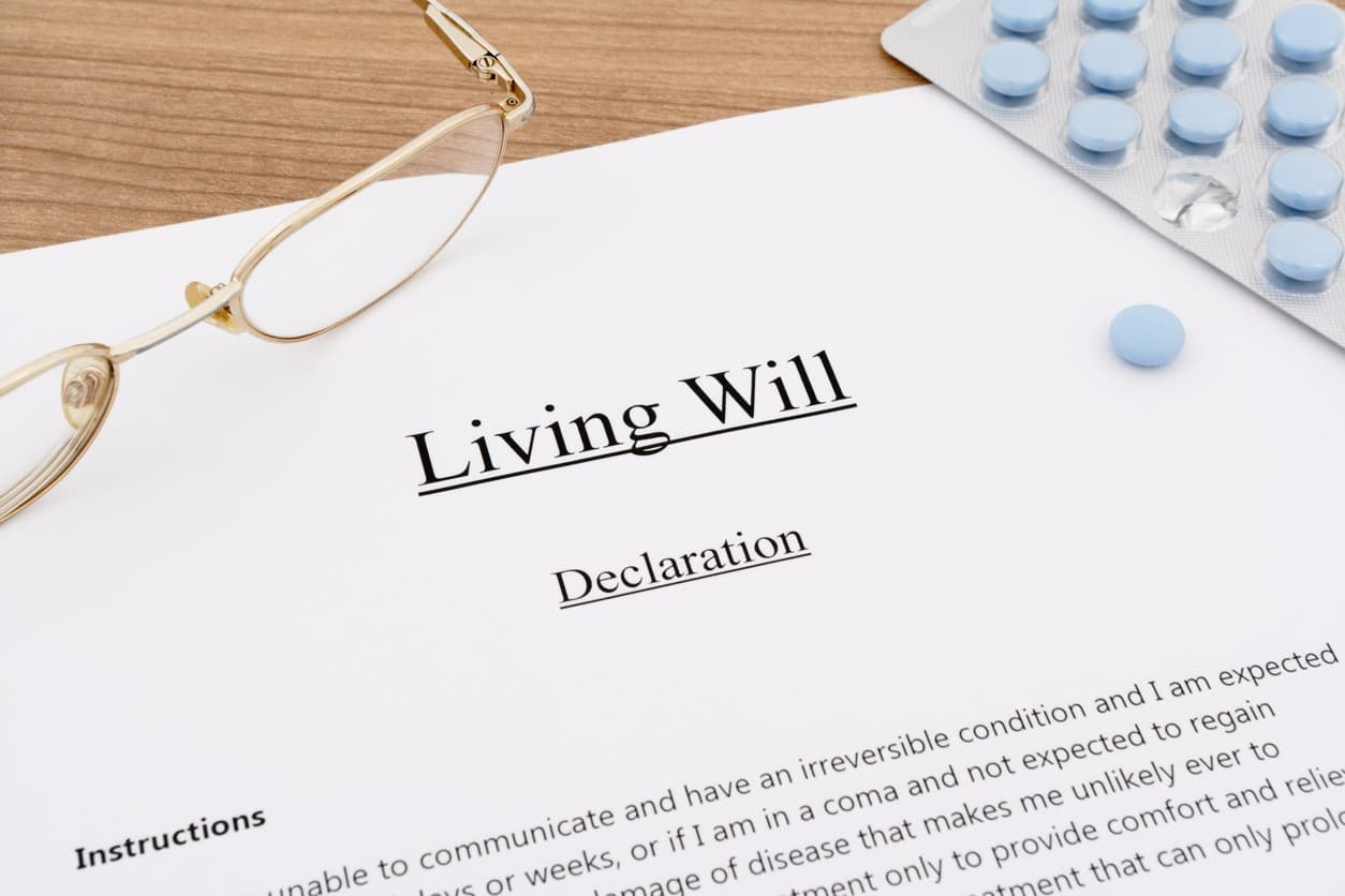 Final Wishes: Making Them Clear Through Proper Documentation living will with medicines and eyeglasses on wooden table final wishes concept