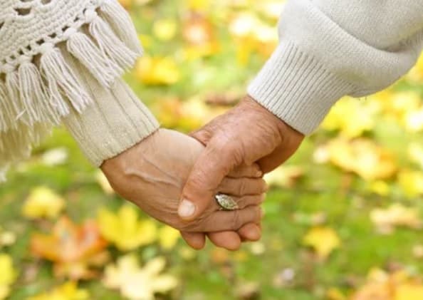 Preparing to Die – What steps to take Two hands being held by a couple that is taking the Steps to Preparing for End of Life