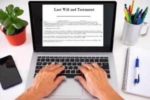 Do It Yourself Will Being Typed on a Laptop Hands typing a do it yourself will on a laptop computer at home.