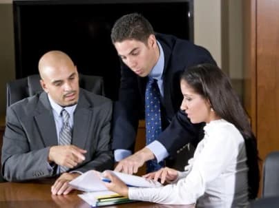 Couple consulting with attorney on Contesting a Will (2) Couple consulting with an attorney about how to contest a will.
